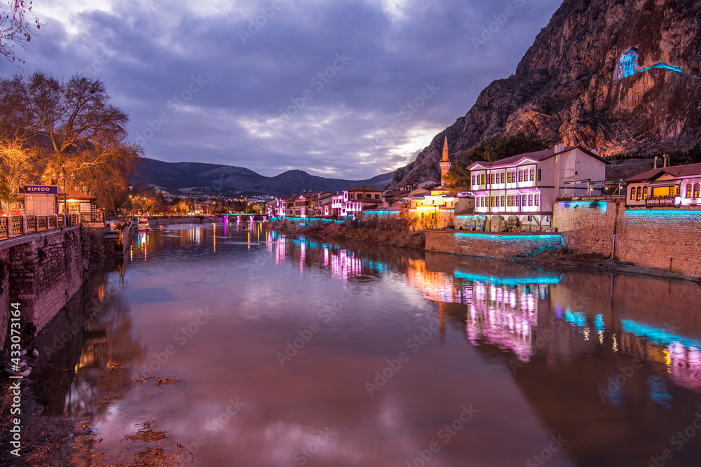 Old Ottoman houses night panoramic view by the Yesilirmak River in Amasya City. Amasya is populer tourist destination in Turkey.