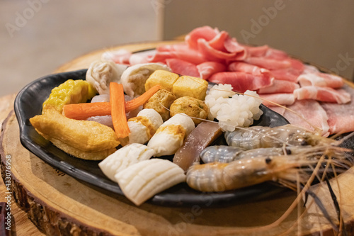 Ingredients of Shabu were arranged in a black plate