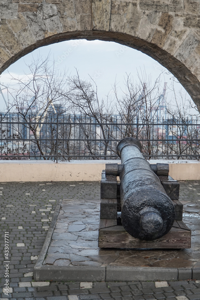 A cannon on the wall of the Khadzhibey fortress in the Odessa park of T.G. Shevchenko.