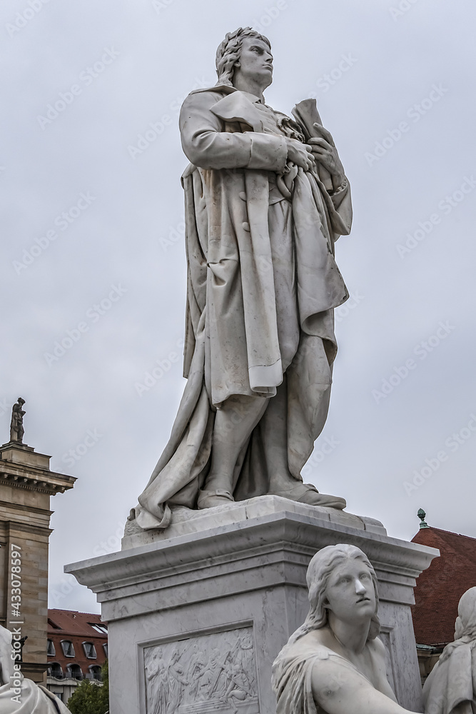 Monument of Germany's poet, philosopher and historian Friedrich Schiller (1871) near Concert Hall on Gendarmenmarkt Square in Berlin, Germany.