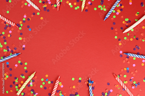 Canvas Print frame of Colorful birthday candles on a red background