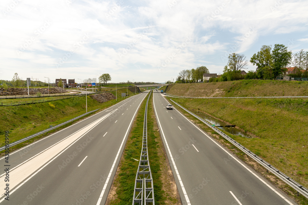 clean and modern highway in the southern Netherlands with very little traffic