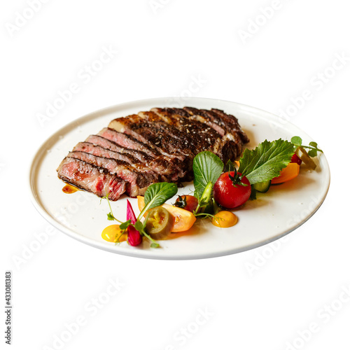 Isolated plate of roast beef with vegetables on the white background