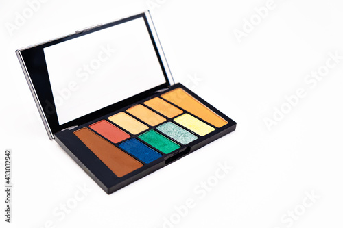colourful eyeshadow makeup palette isolated on white background. make up artist tools