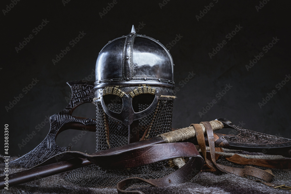 Studio shot of knight helmet around axe and fur - obrazy, fototapety, plakaty 