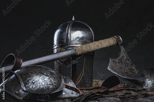 Medieval suit of armor of knight against dark background