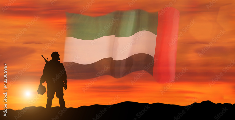 Silhouette Of A Solider Saluting Against the flag of UAE. Concept of national muslim holidays. Independence Day, Victory Day.