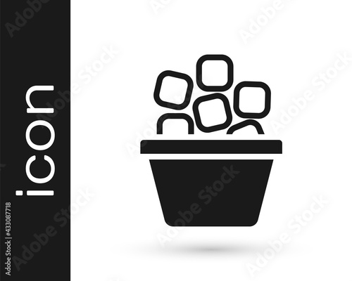 Black Ice bucket filled with ice cubes icon isolated on white background. Vector