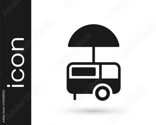 Black Fast street food cart with awning icon isolated on white background. Urban kiosk. Ice cream truck. Vector