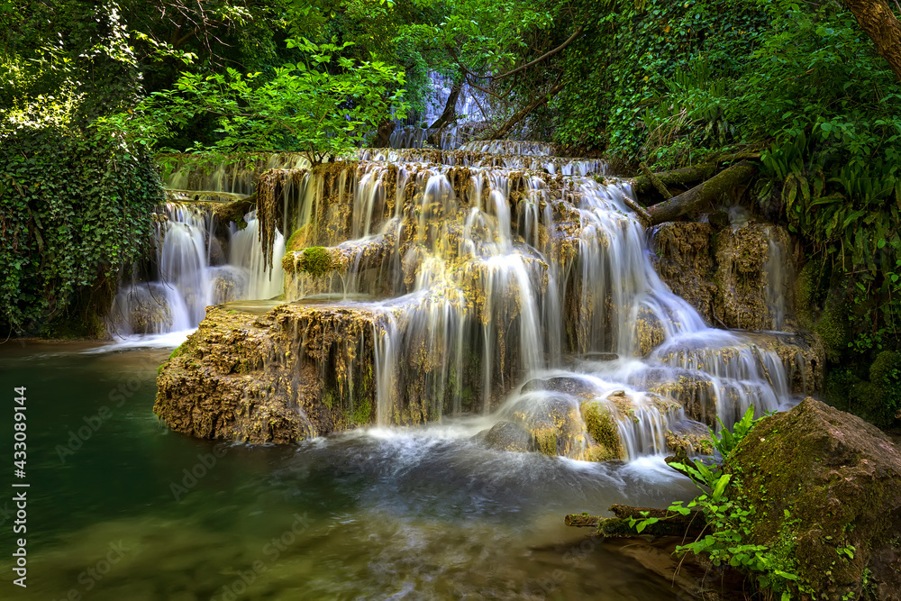 Obraz premium Cascade waterfalls. Krushuna falls in Bulgaria near the village of Krushuna, Letnitsa.