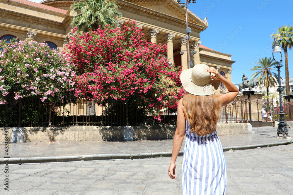 Travel in Sicily. Back view of beautiful woman visiting Palermo, Italy. 