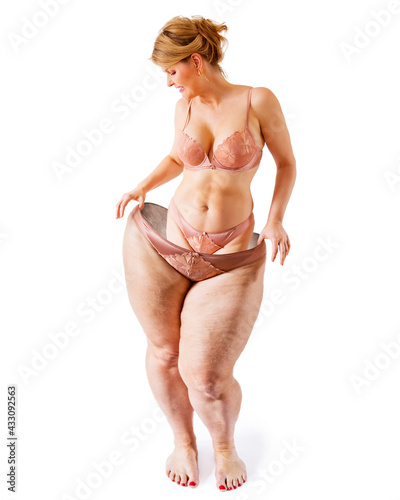 Weight loss concept showing fit woman stepping out of her old fat  body shape.