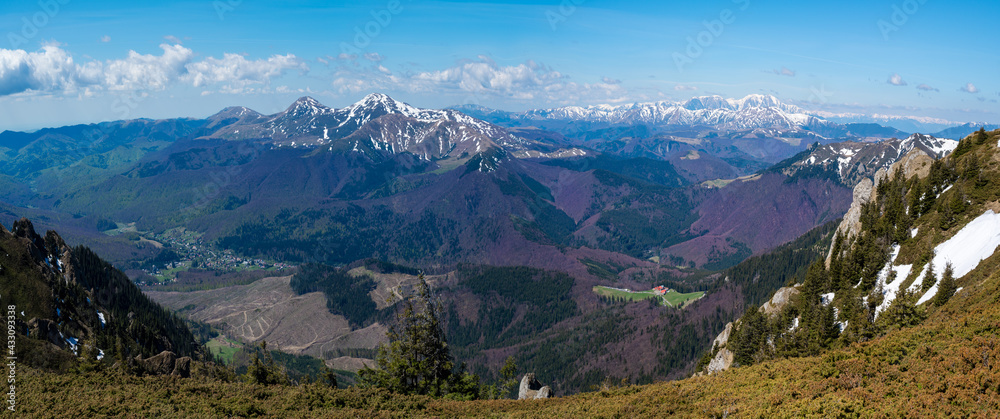 Aerial panoramic view of Ciucas mountain peaks and the skyline in the springtime in Romania - Europe