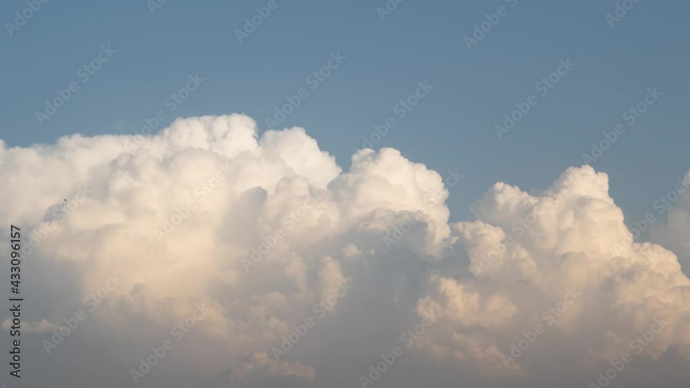 4K Time lapse of the clouds during the sunset, White Clouds slowly turning orange during the sunset 4K Time lapse of the clouds during the sunset, White Clouds slowly turning orange during the sunset