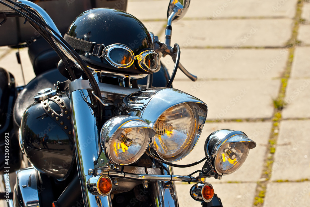 Fototapeta premium Motorcycle steering wheel closeup. Chrome steering wheel elements.