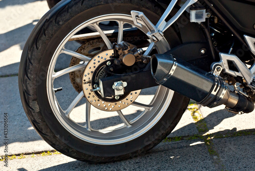 Motorcycle wheel closeup. Motorcycle metal parts. Biker meeting in the city.