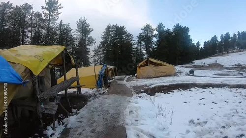 Point of View hyper lapse of the way to Bijli Mahadev Temple covered by snow on both sides during winter in Kullu at Himchal Pradesh, India photo