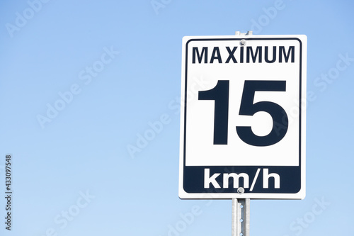 15 km per hour Road Speed Sign with Blue Sky Background.