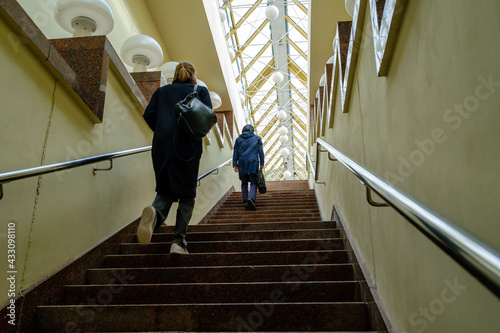 People walking up staircase at daytime