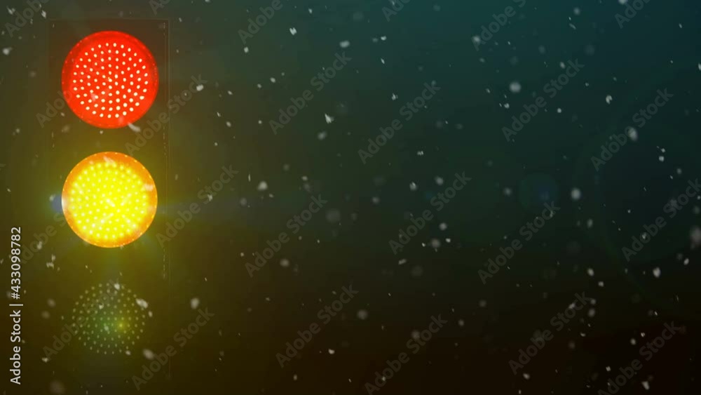 Light traffic  Yellow, red and green colors. Snowy night