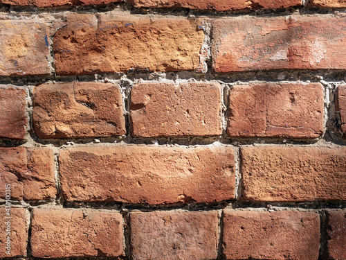 Background of red-brick masonry texture. Pattern of rude 250-years old wall. Close-up