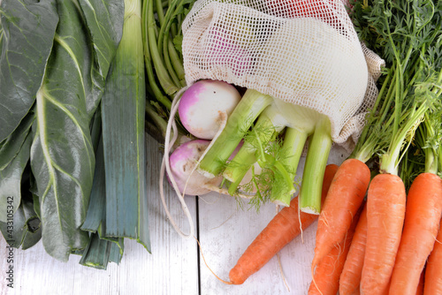 fresh vegetables in a  bag among other  fresh vegetables