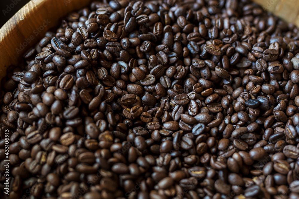 coffee beans in wooden bowl coffee beans in wooden bowl