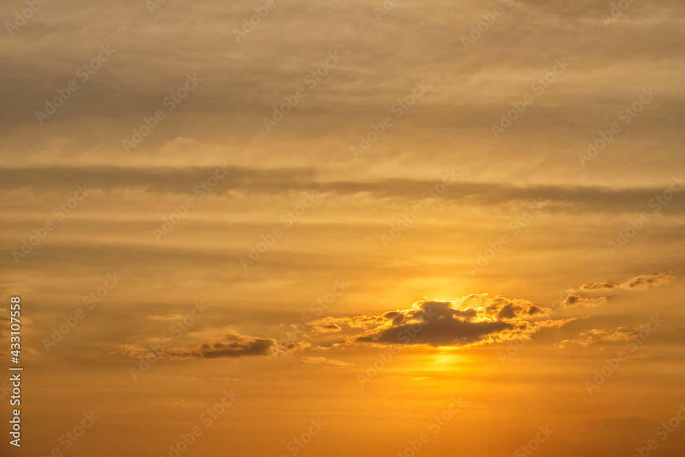 Sunset behind clouds over in the sea Sunset behind clouds over in the sea