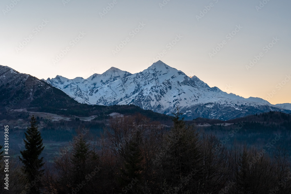 Fototapeta Mount Tetnuldi rises above the Great Caucasian Range in the upper Svaneti