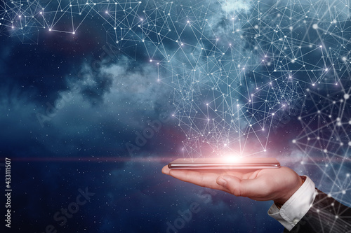 Hand shows a telephone that is connected to space by a network of connections.