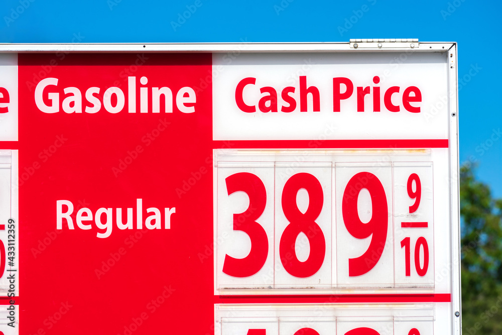 Fototapeta premium High gas prices on red sign. Cash price for regular gasoline