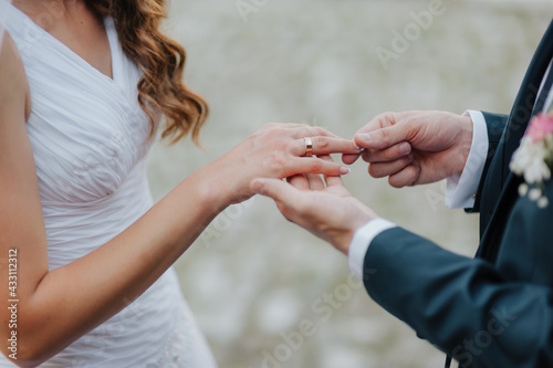 stylish bridal couple posing on their wedding day, happy bride and groom together