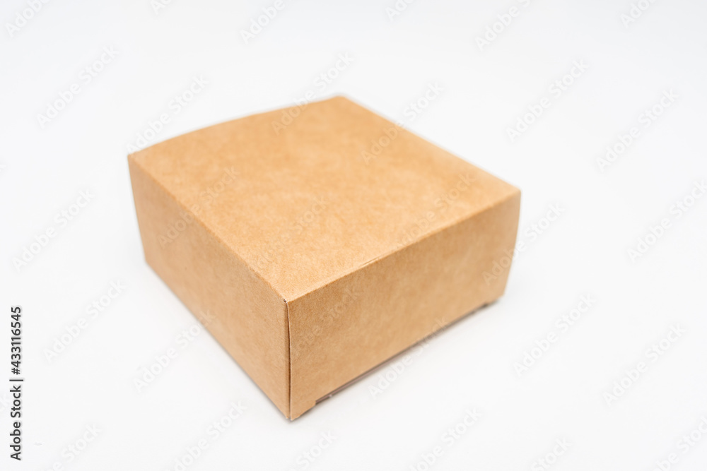 Brown cardboard box, white background, copy space Brown cardboard box, white background, copy space