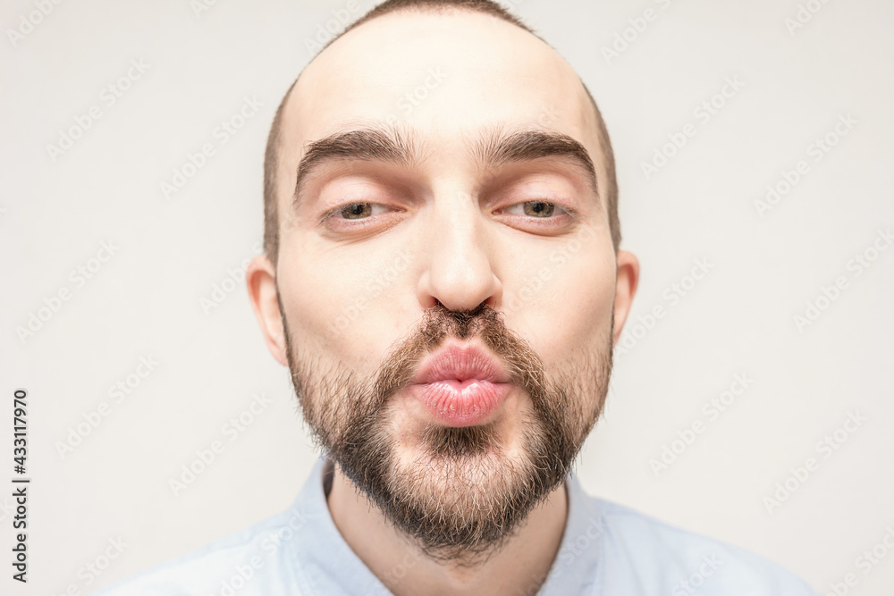 Fototapeta premium In love person sending air kiss, portrait, close up