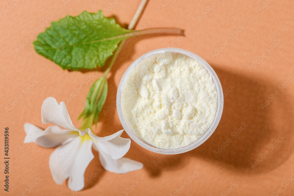 Dried Royal jelly powder on orange background. Dried Royal jelly powder on orange background.