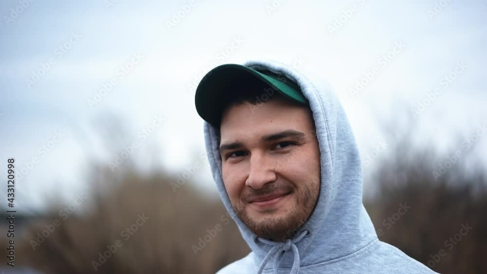 Young attractive guy of Caucasian appearance smiles Young attractive guy of Caucasian appearance smiles