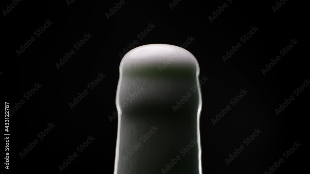 Beer foam escapes from bootle Beer foam escapes from bootle