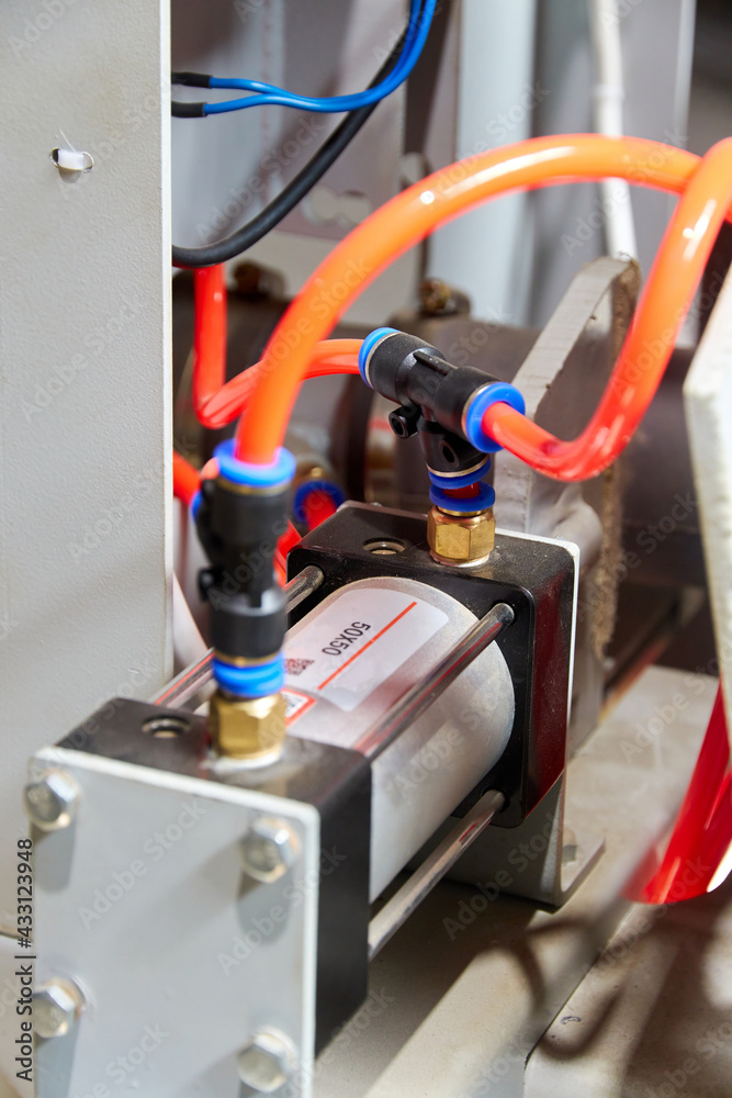plastic tubes of the pneumatic system connected to the pneumatic cylinder plastic tubes of the pneumatic system connected to the pneumatic cylinder