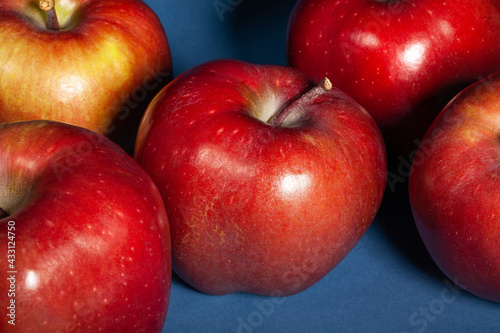 red delicious apple on blue background