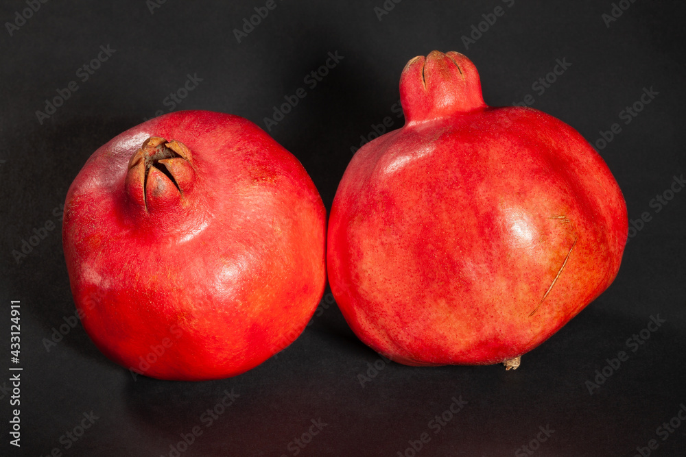 pomegranate group on black background pomegranate group on black background