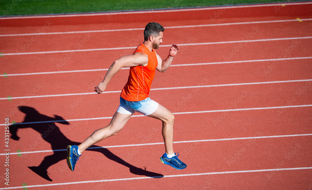 Fototapeta premium physical training. athletic guy run. challenge and competition. marathon speed. sprinter.
