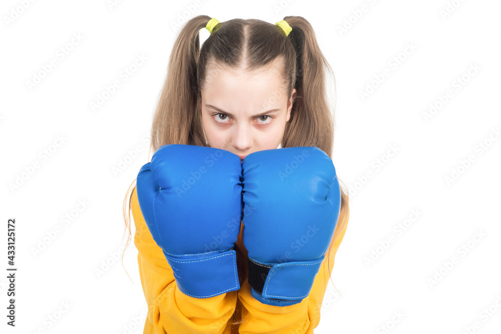 concentrated kid punching. fist to fight. teen girl in boxing gloves. angry attack. concentrated kid punching. fist to fight. teen girl in boxing gloves. angry attack.
