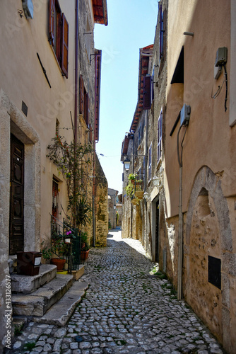 Sermoneta, Italy, 05/10/2021. A street between old medieval stone buildings in the historic town. © Giambattista