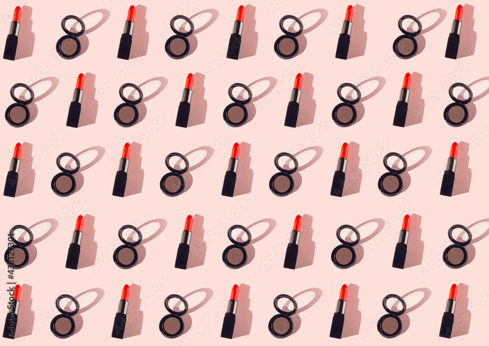 Creative pattern made of red lipsticks and eyeshadows on pastel background. Cosmetic and makeup concept. Beauty and fashion theme. Top view. Flat lay Creative pattern made of red lipsticks and eyeshadows on pastel background. Cosmetic and makeup concept. Beauty and fashion theme. Top view. Flat lay