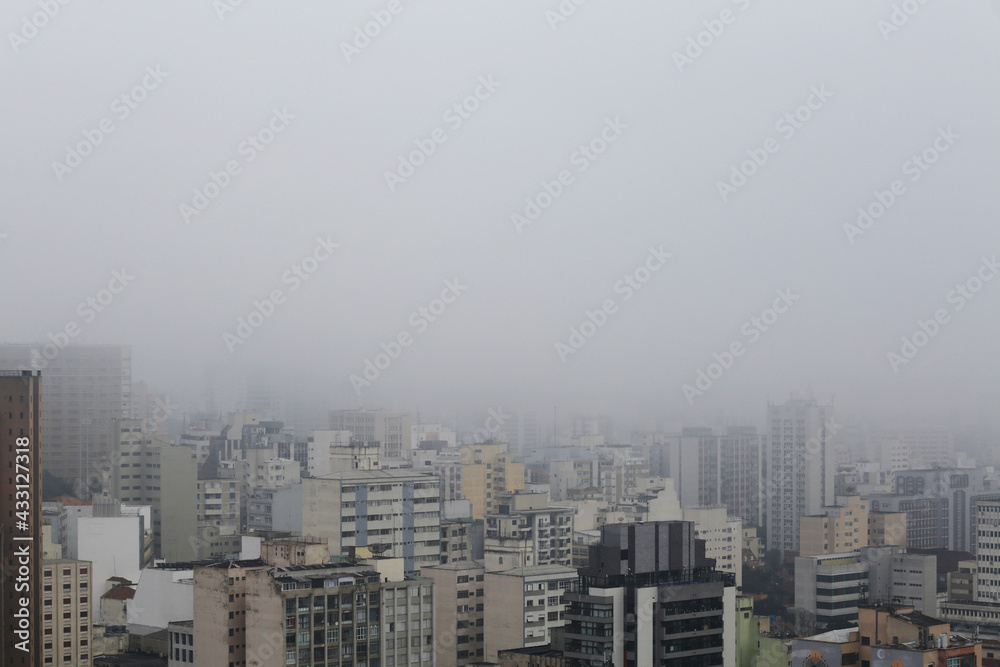 Dense fog cover the city of Sao Paulo, downtown district, Brazil, during early morning.