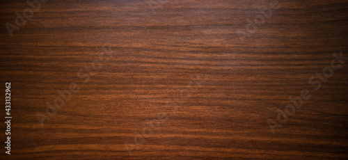 Photo of an antique mahogany texture with black horizontal Art Nouveau stripes