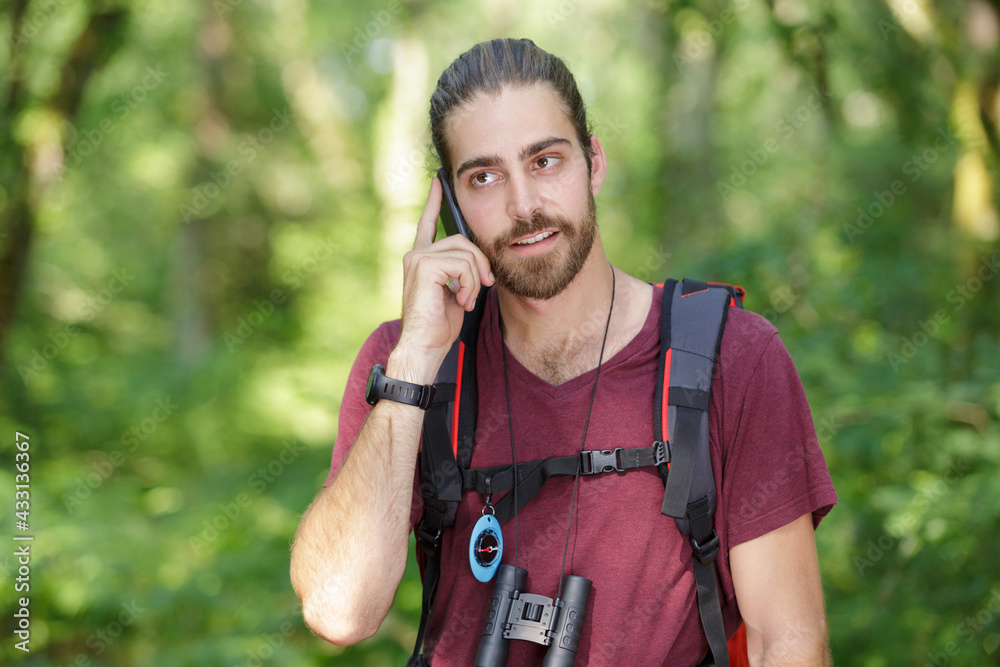 a hiker on the phone a hiker on the phone