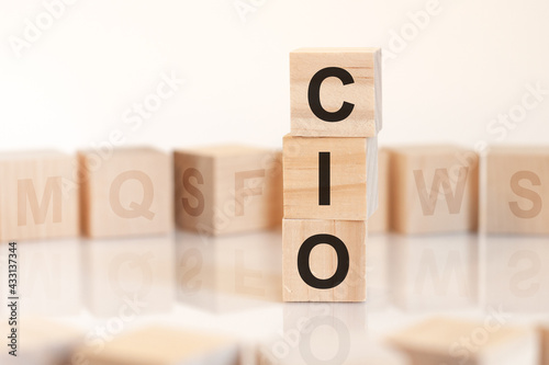 word cio from wooden blocks with letters, concept