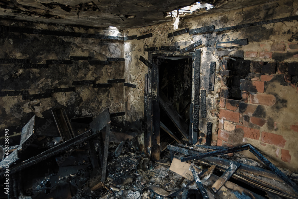 Burnt old house interior. Consequences of fire Burnt old house interior. Consequences of fire