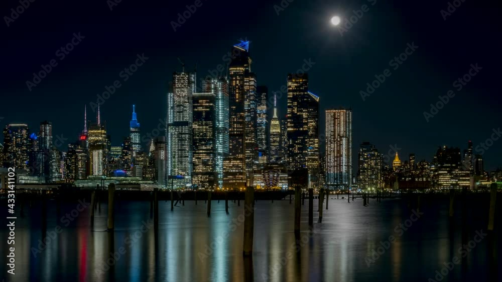 Wide Angle View of Pink Full Moon Rising Time-lapse Over Hudson Yards and Empire State Building in April Wide Angle View of Pink Full Moon Rising Time-lapse Over Hudson Yards and Empire State Building in April